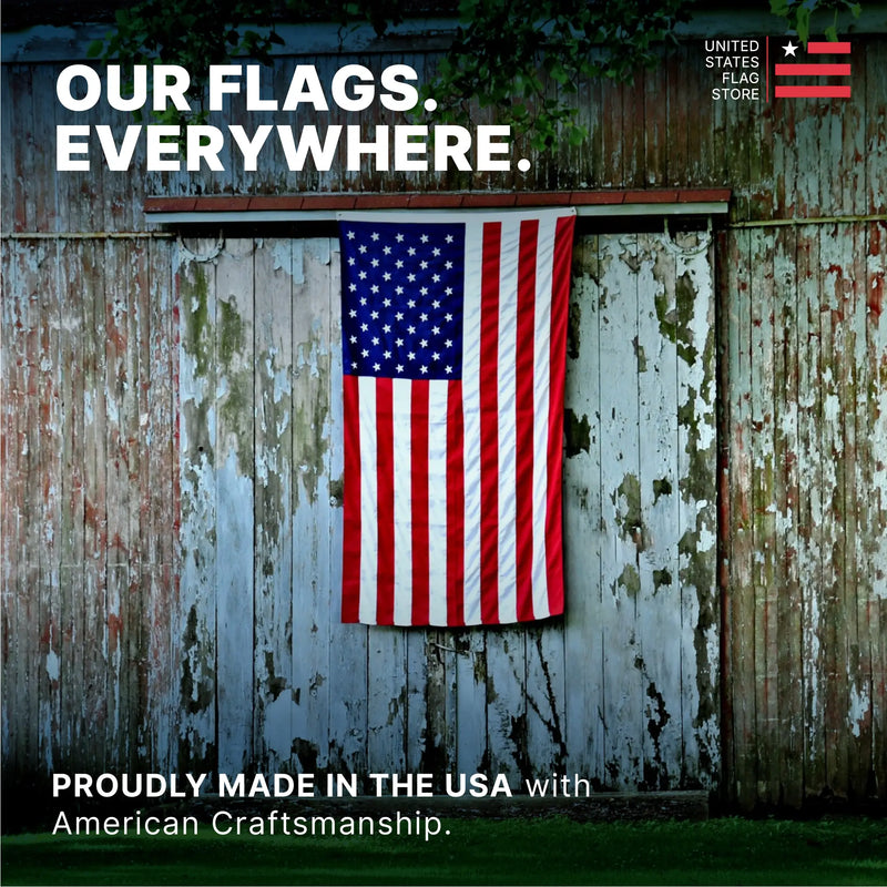 American flag hanging on a weathered wooden fence with text about the flag store.